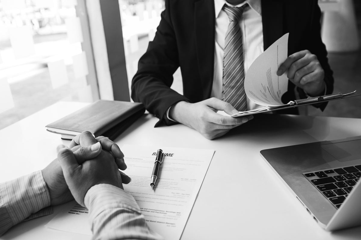Two professionals reviewing documents at a table